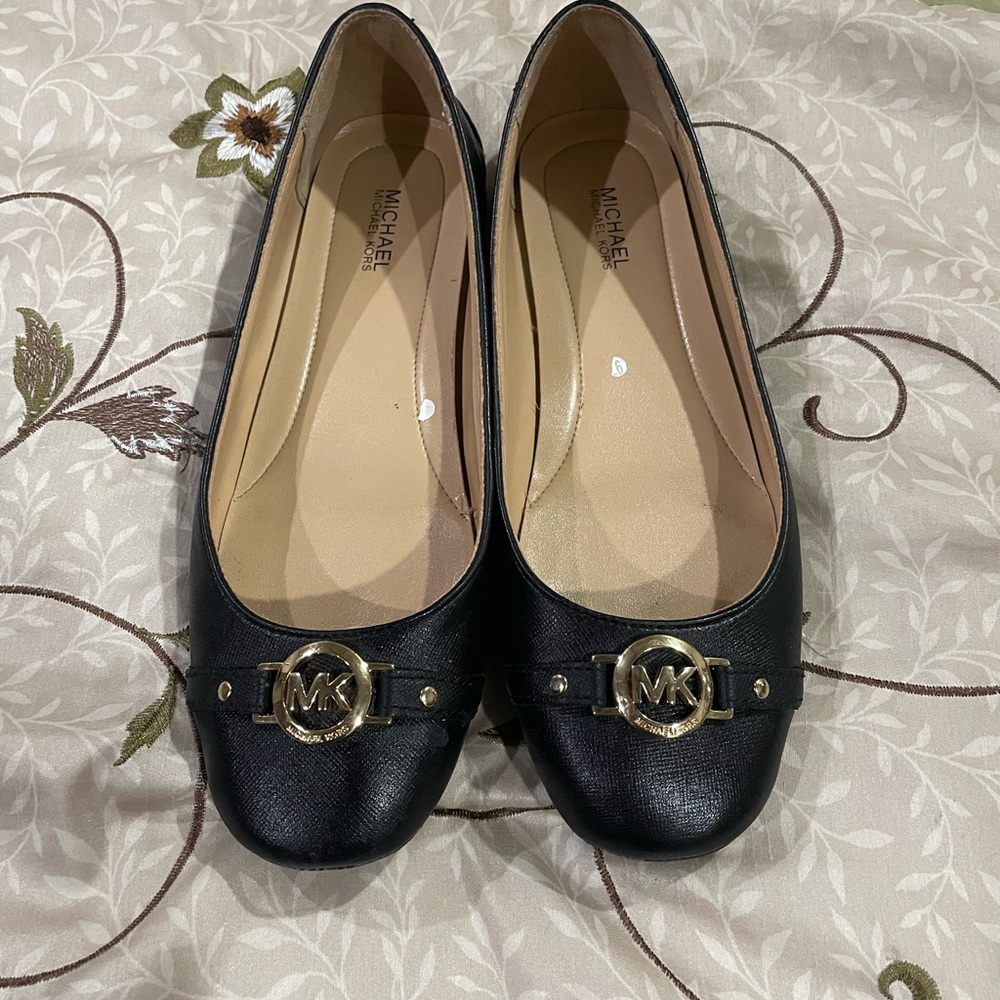 Michael Kors black flats.
